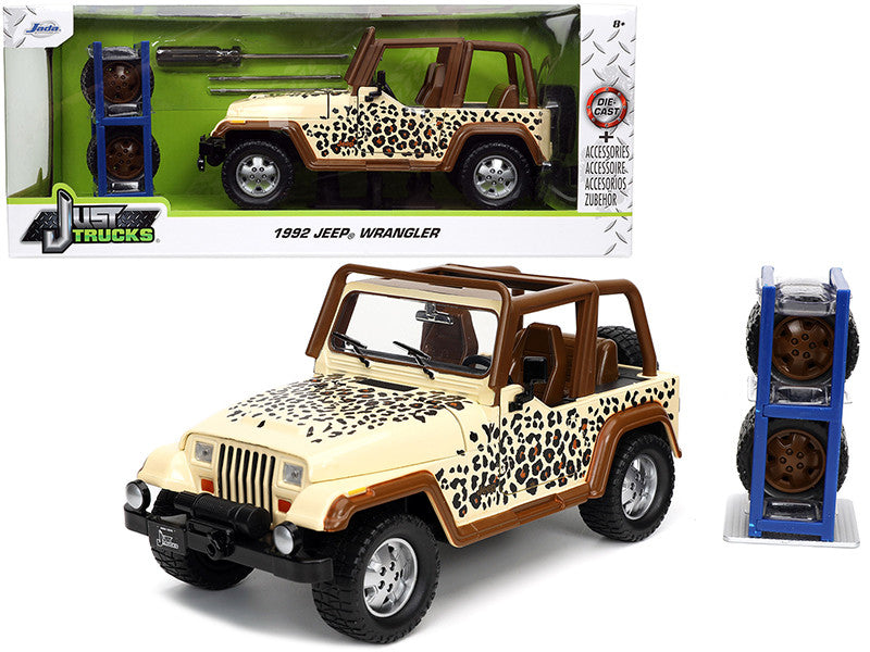 1992 Jeep Wrangler Tan and Brown with Graphics and Extra Wheels "Just Trucks" Series 1/24 Diecast Model Car by Jada-0