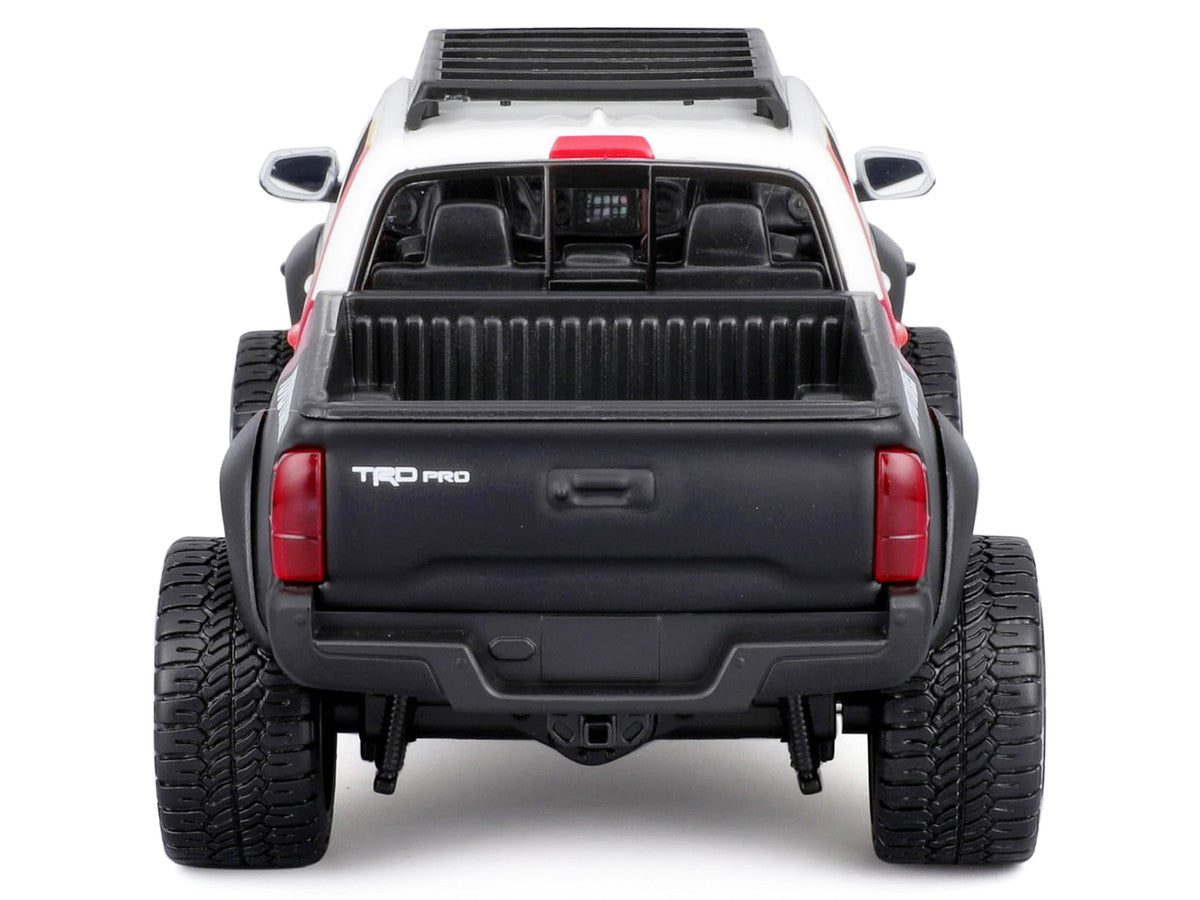 2023 Toyota Tacoma TRD PRO Off Road Pickup Truck White with Graphics and Roof Rack "Maisto Design" Series 1/27 Diecast Model Car Maisto-0