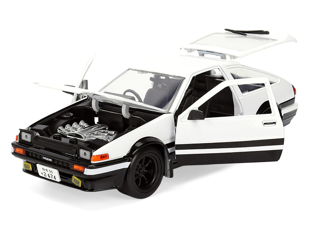 Toyota Trueno (AE86) RHD (Right Hand Drive) White and Black with Graphics and Takumi Diecast Figure "Initial D" (1998-2021) TV Series "Anime Hollywood Rides" Series 1/24 Diecast Model by Jada-0