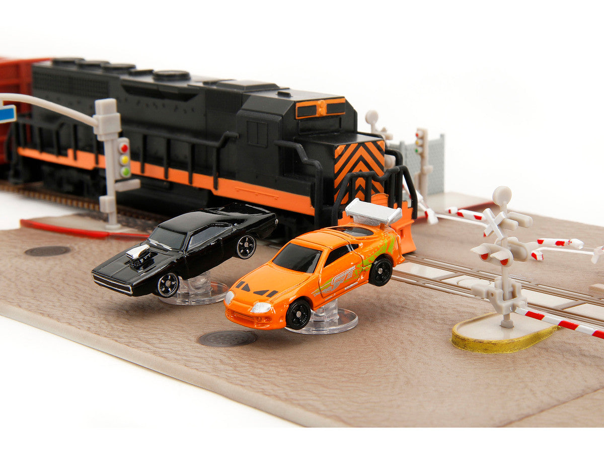 "Fast & Furious" Final Race Diorama with Toyota Supra Orange and Dodge Charger Black "Nano Scene" Series model by Jada-4