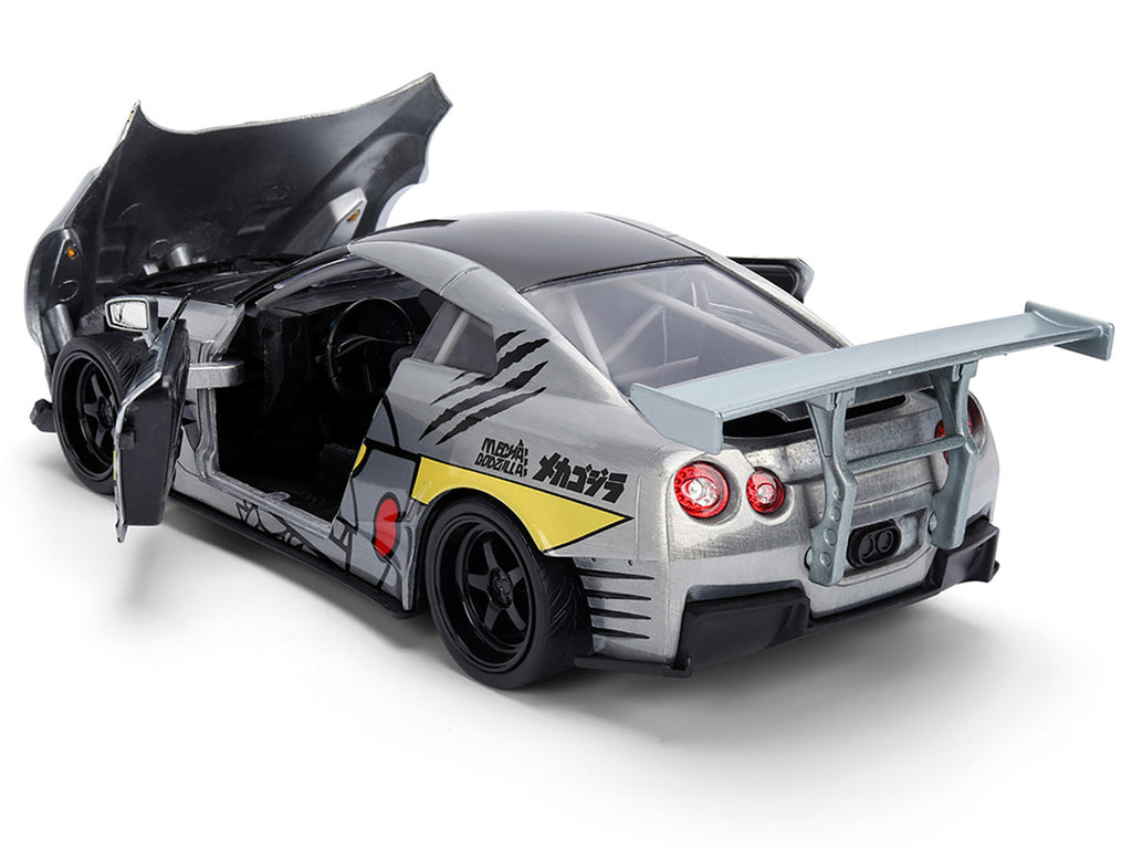 2009 Nissan GT-R (R35) Ben Sopra Brushed Metal with Black Top and Graphics and Mechagodzilla Diecast Figure "Godzilla" Franchise "Anime Hollywood Rides" Series 1/24 Diecast Model by Jada-1