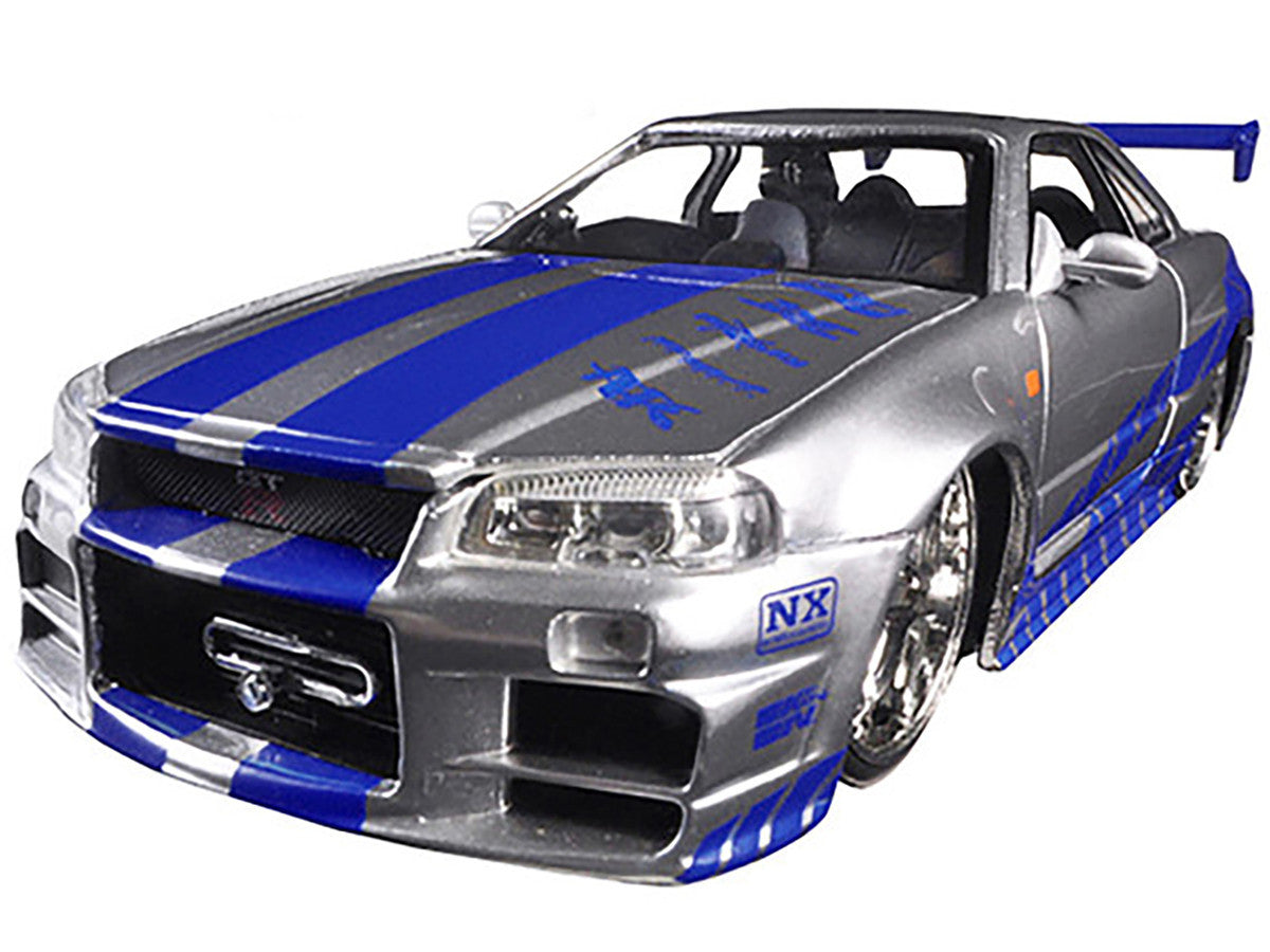 Brian's Nissan GTR Skyline R34 RHD (Right Hand Drive) Silver with Blue Stripes "Fast & Furious 25th Anniversary" 1/24 Diecast Model Car by Jada-1
