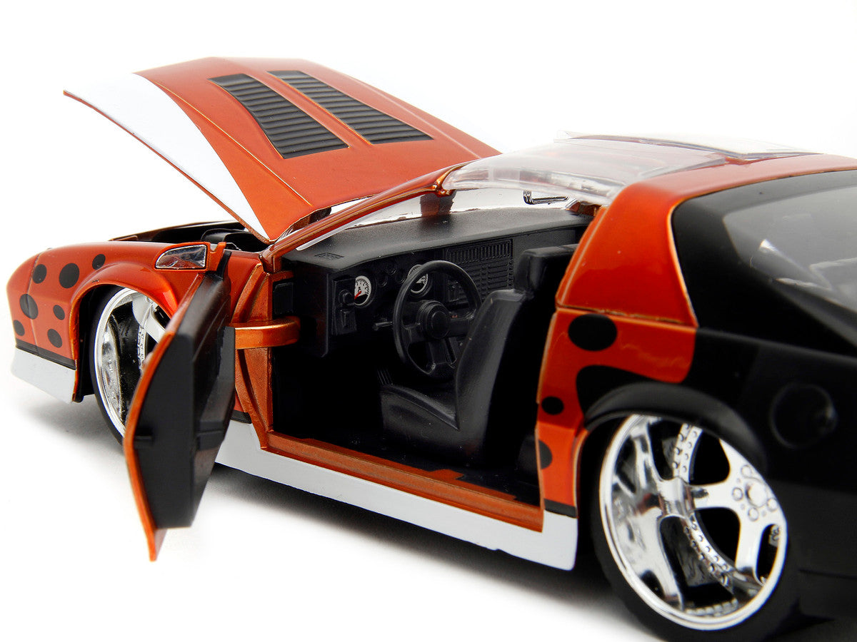 1985 Chevrolet Camaro Z/28 Orange Metallic with Graphics and Chester Cheetah Diecast Figure "Cheetos" "Hollywood Rides" Series 1/24 Diecast Model Car by Jada-2